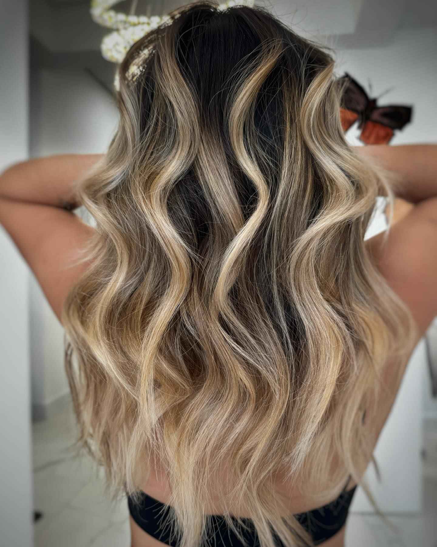 Long golden blonde waves with dark lowlights