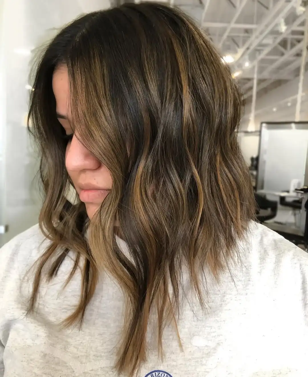 Textured lob with sun-kissed highlights for a beachy vibe