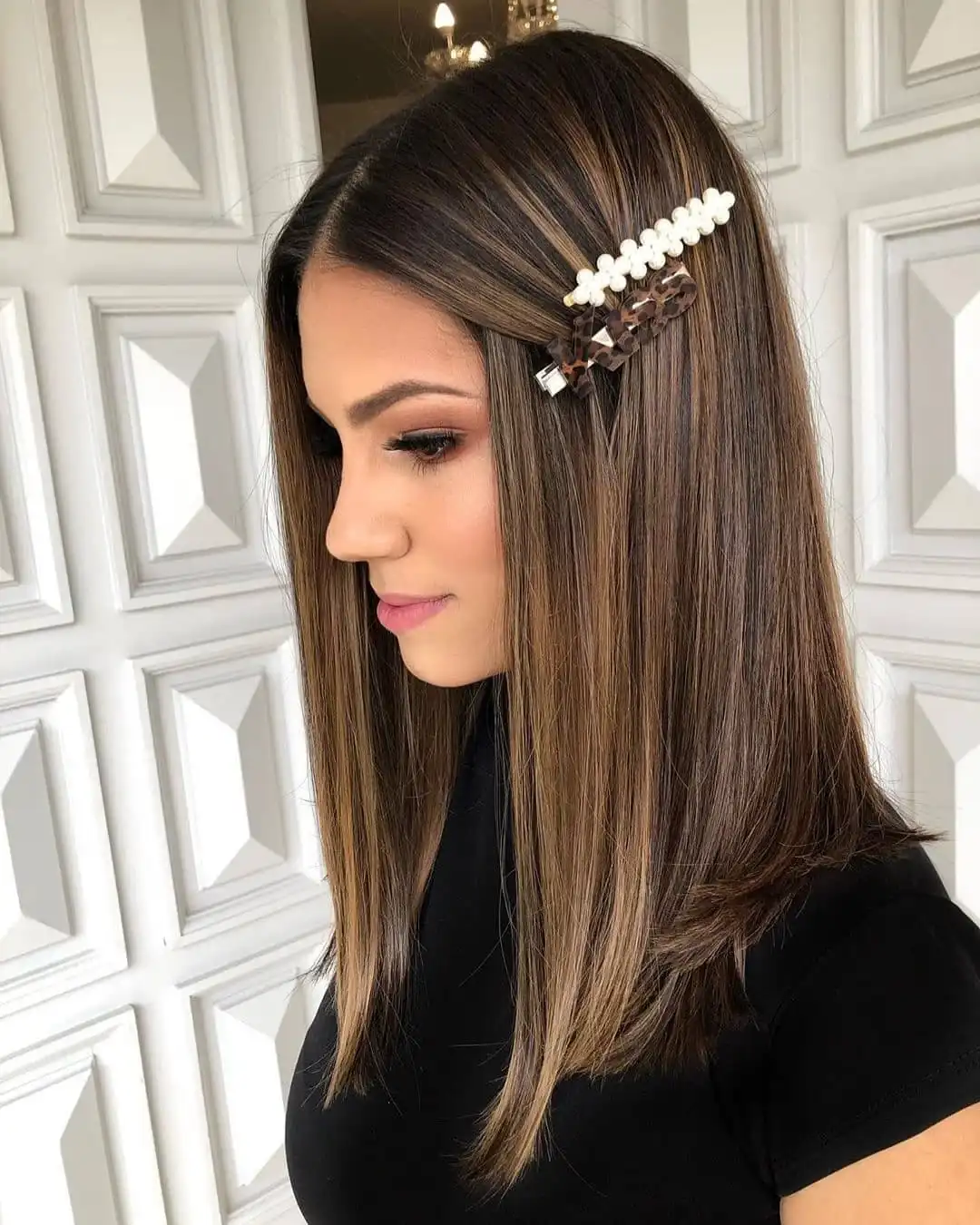 Classic straight cut with subtle layers for timeless elegance