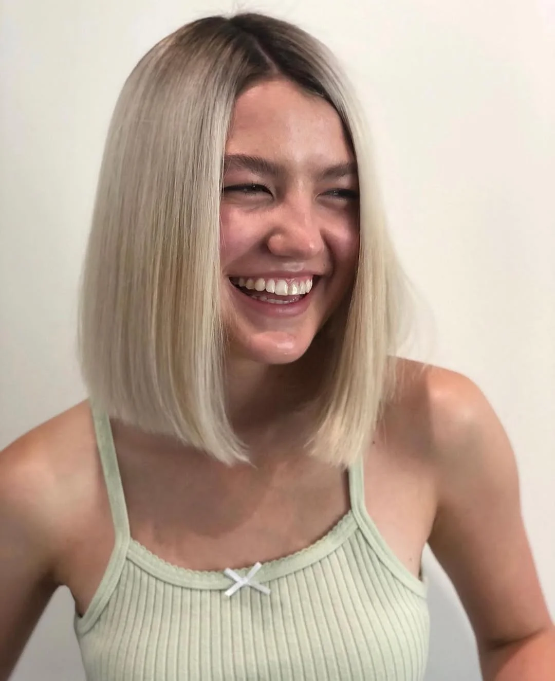 Blunt bob with platinum glow for bold statement