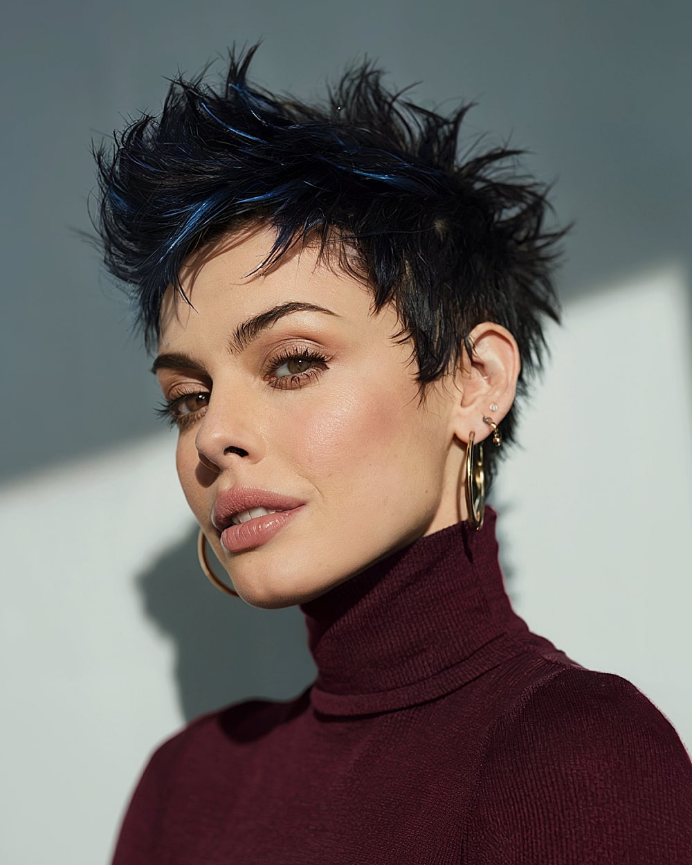 Edgy pixie with blue highlights for bold personality