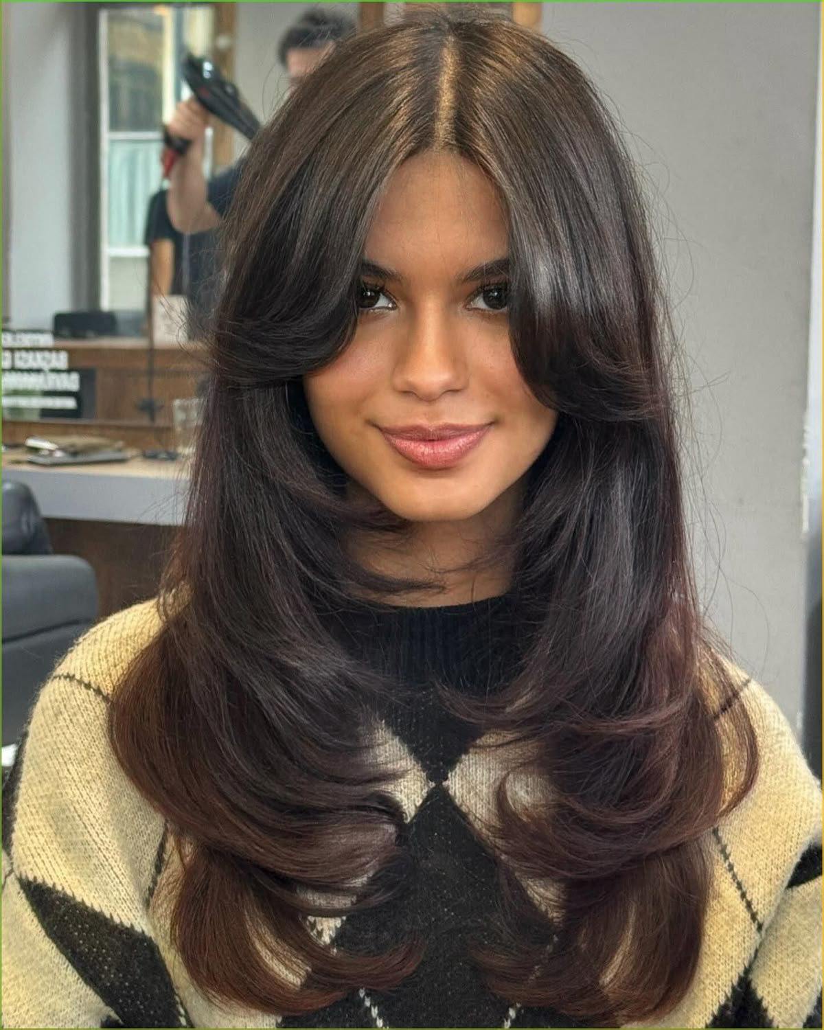 Feathered layers with curtain bangs for retro chic