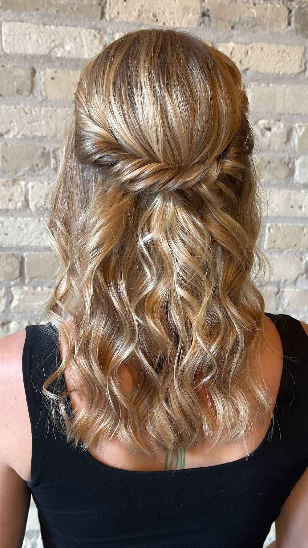 Romantic half-up hairstyle with soft curls