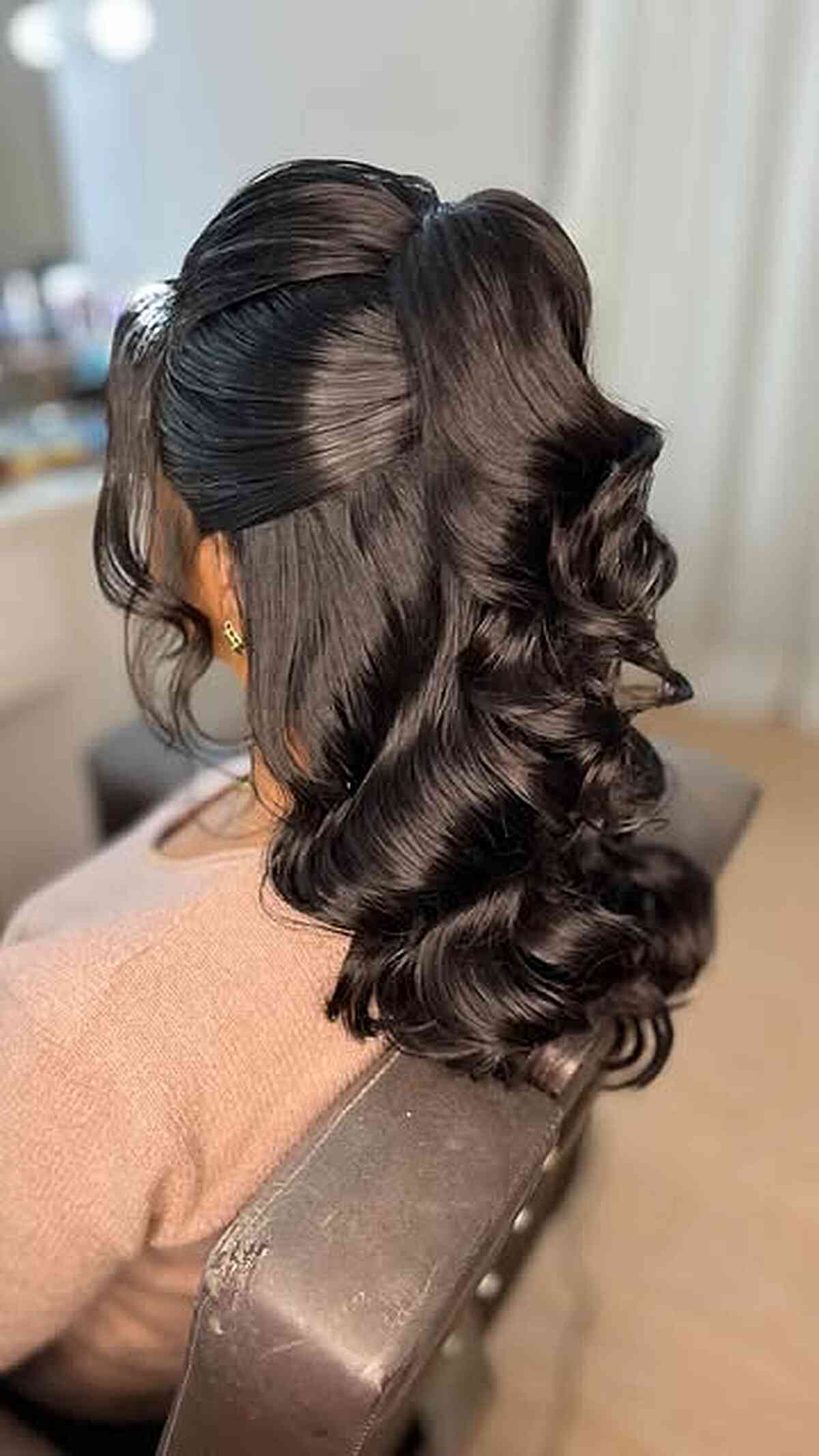 Glossy Hollywood waves with deep side part