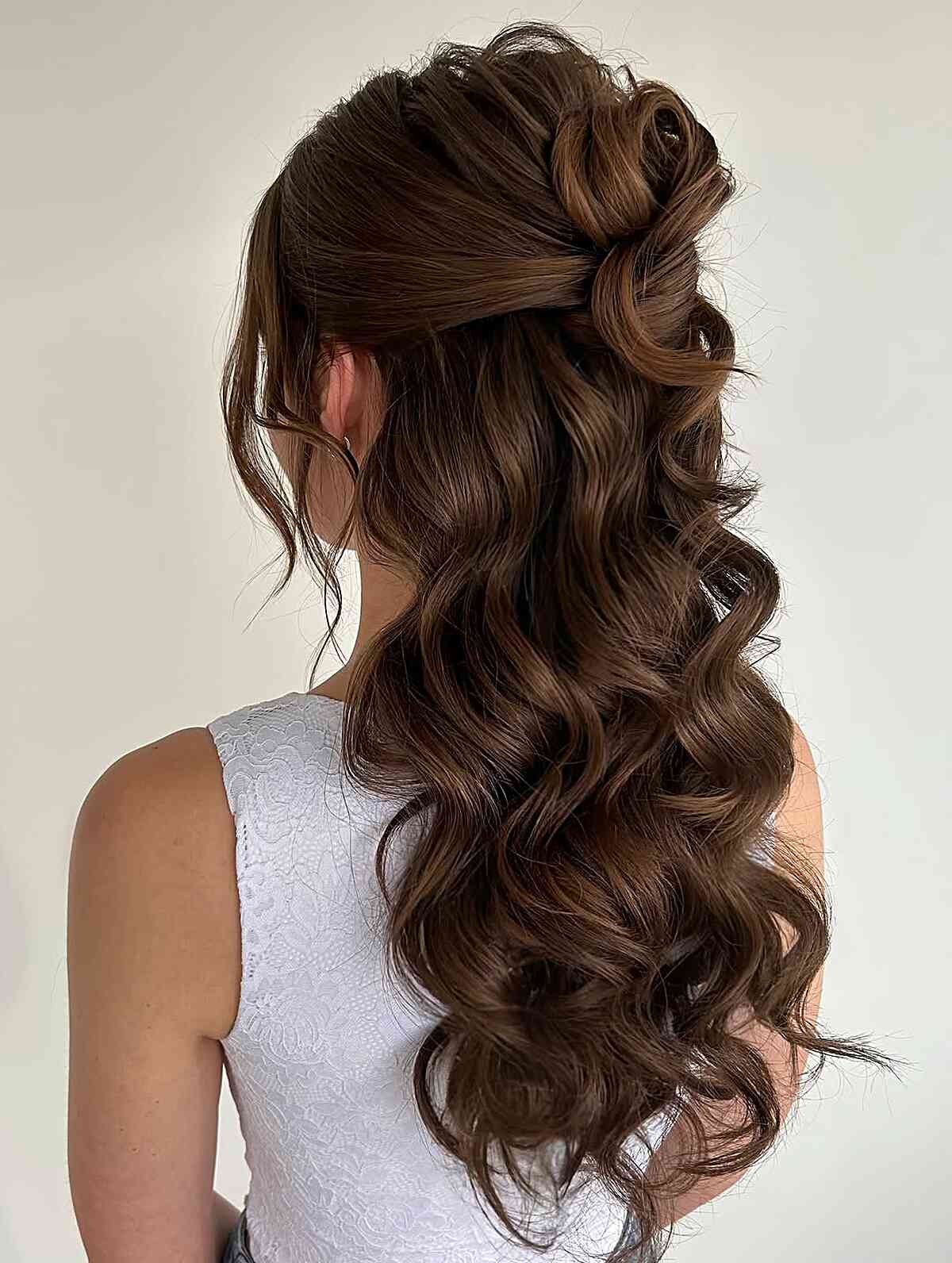 Romantic cascading curls with half-up twist