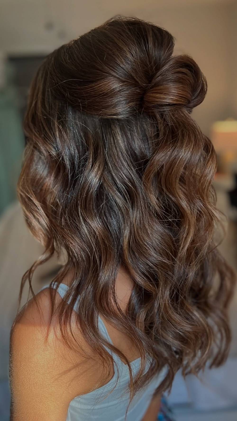 Half-up bow hairstyle with soft waves