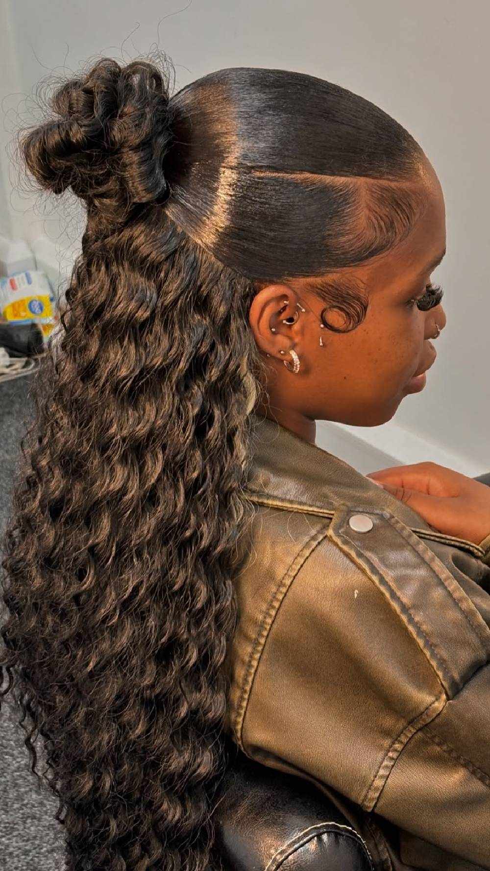High sleek bun with textured ends
