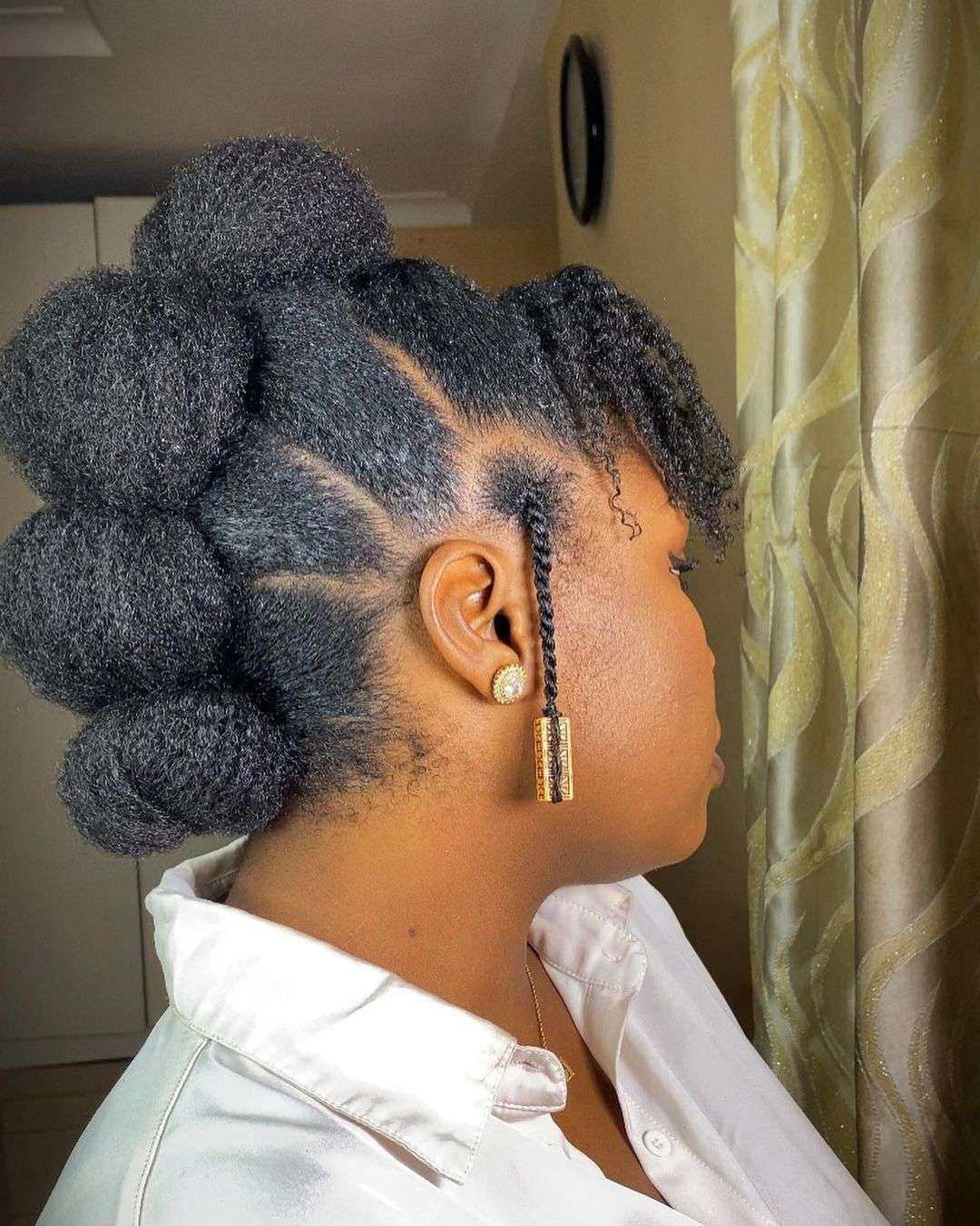 Bubble ponytail with braid accents and volume