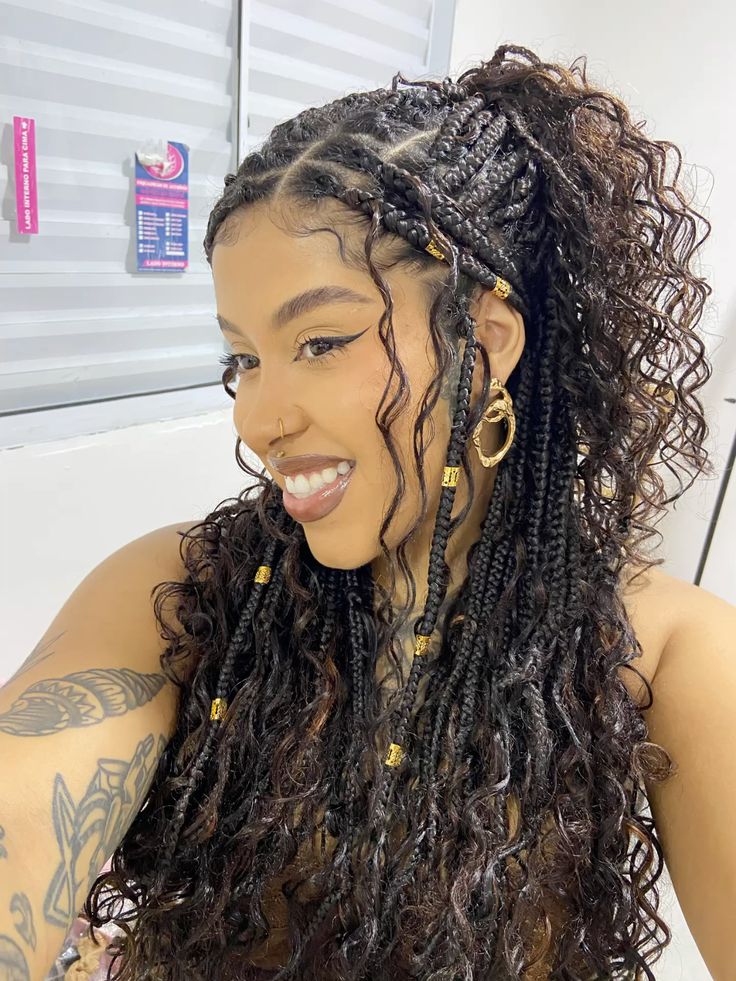 Half-up braids with cascading curls and gold beads