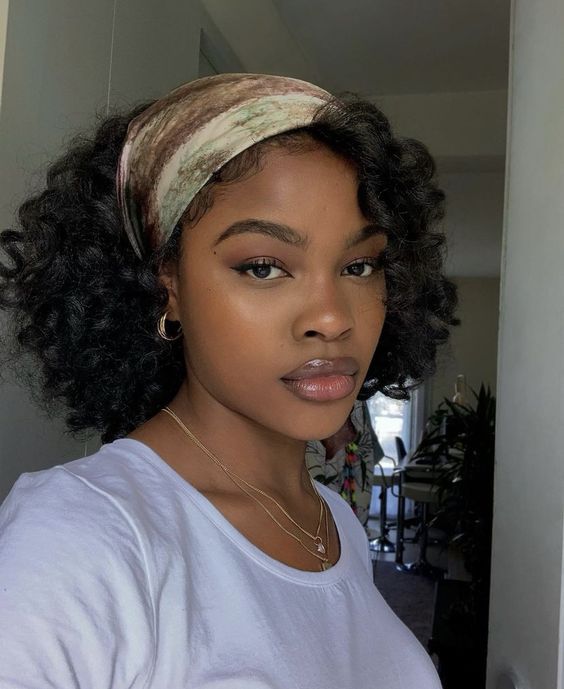 Curly bob with headband for stylish look