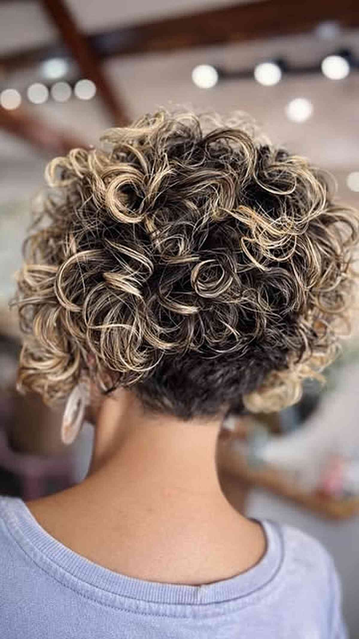 Curly bob with blonde tips for a playful touch