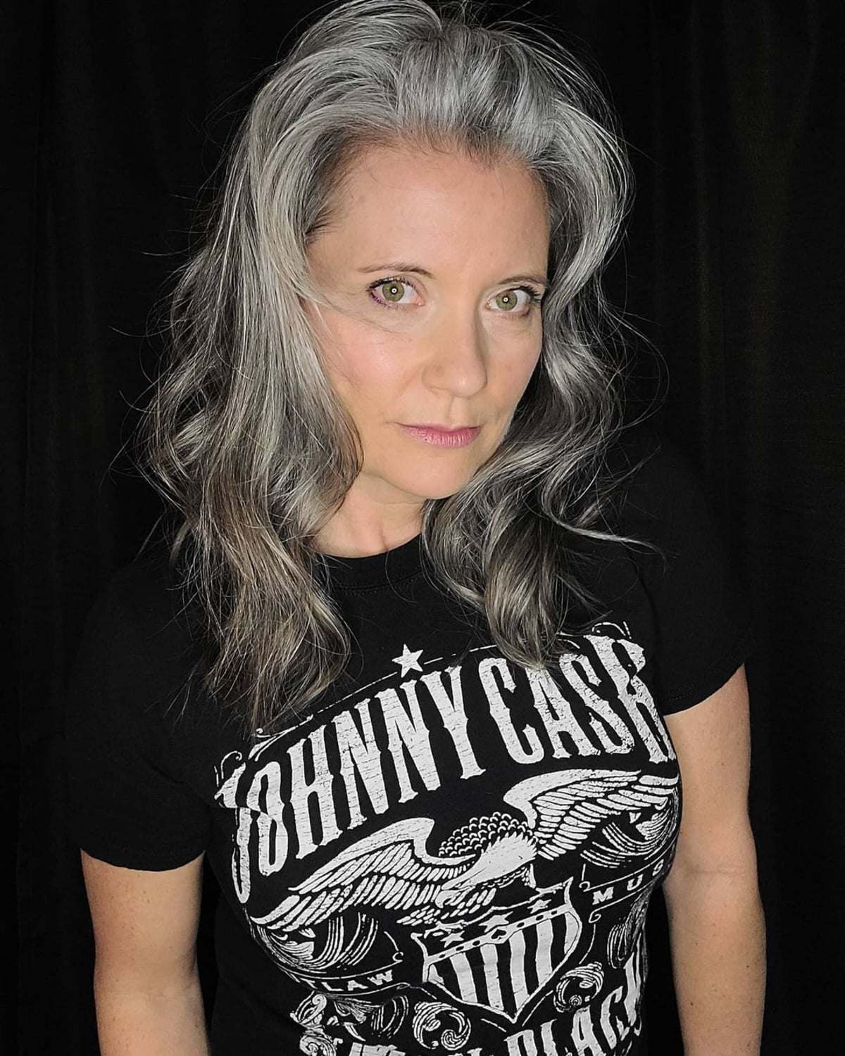 Long wavy hairstyle with silver highlights