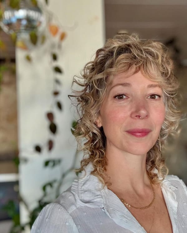 Curly shag cut with bangs for older women
