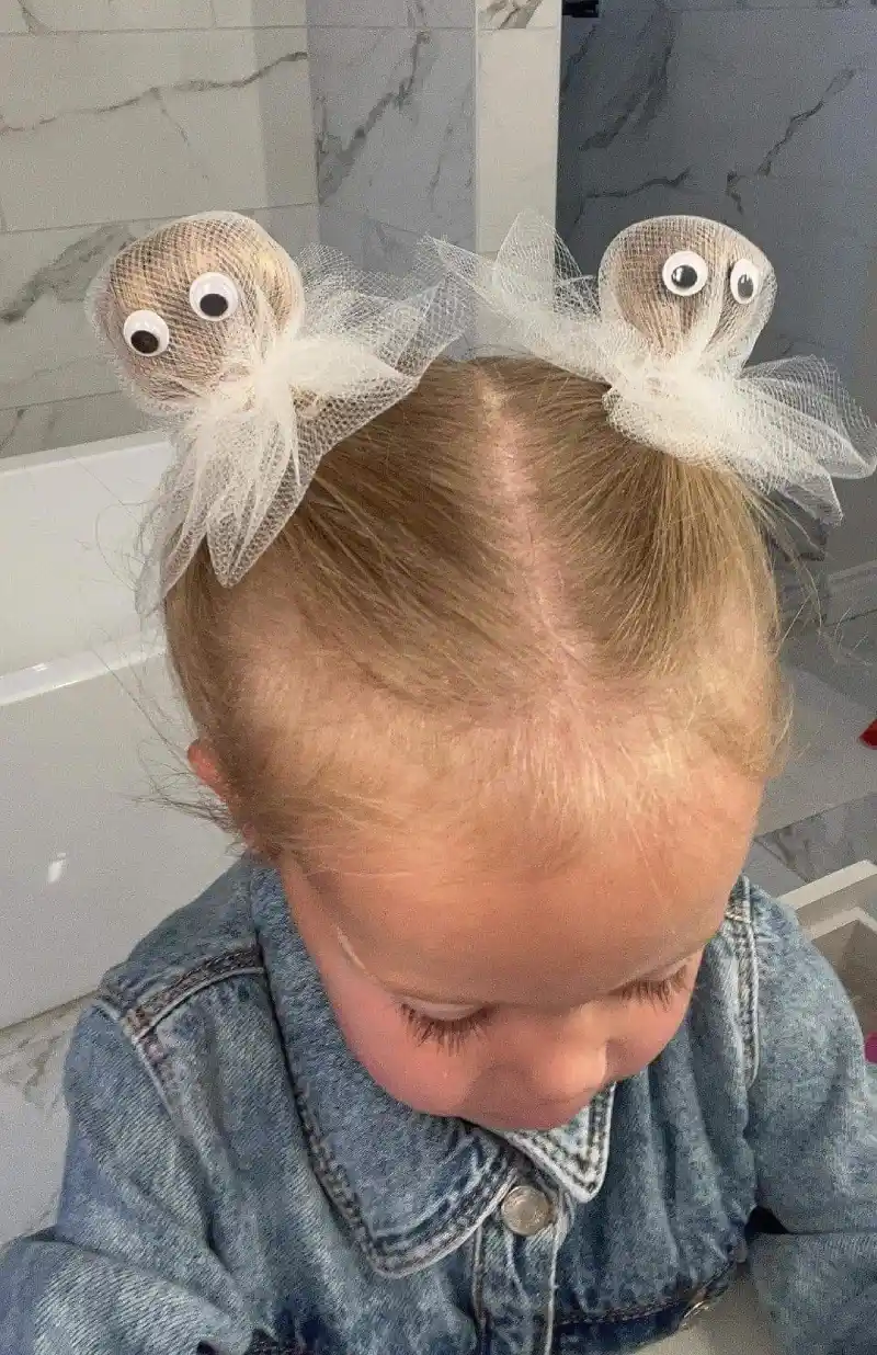 Snail-inspired buns with googly eyes for kids