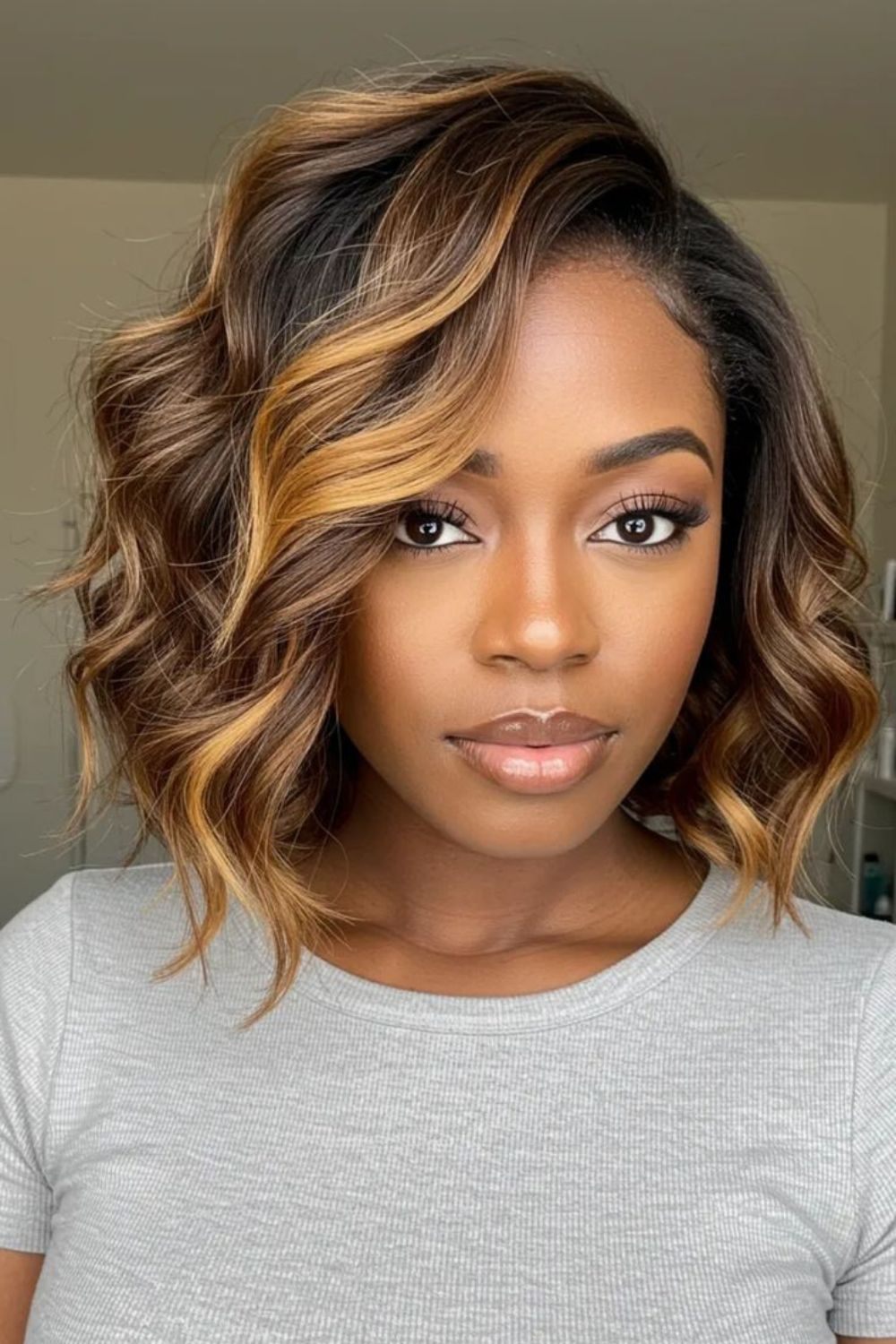 Chic honey blonde wavy bob hairstyle