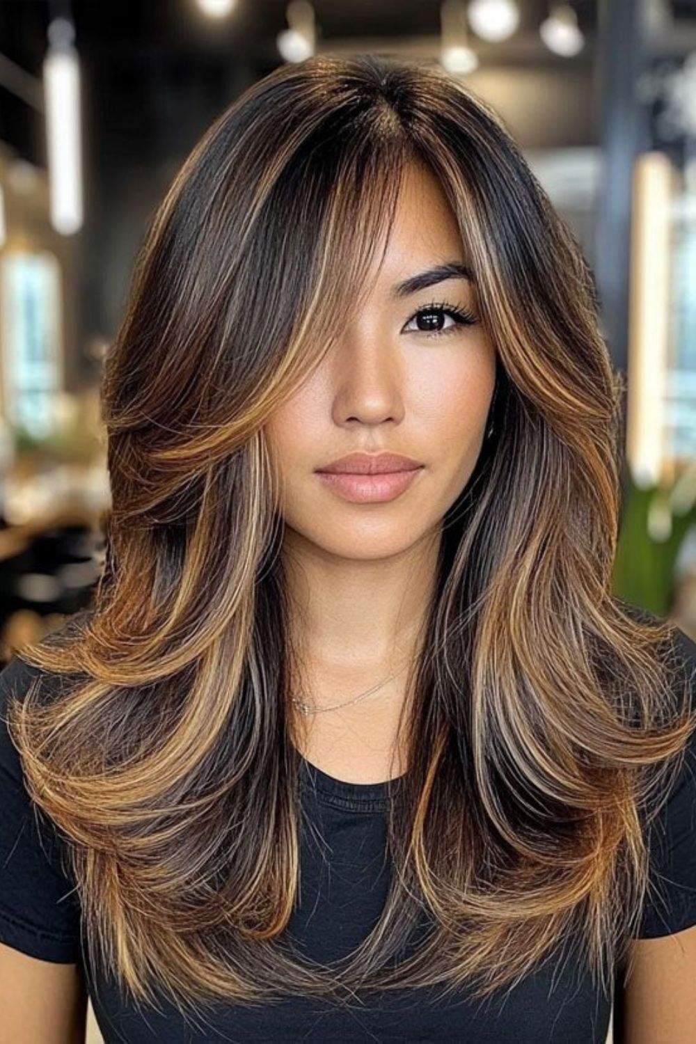 Layered hair with voluminous honey blonde highlights