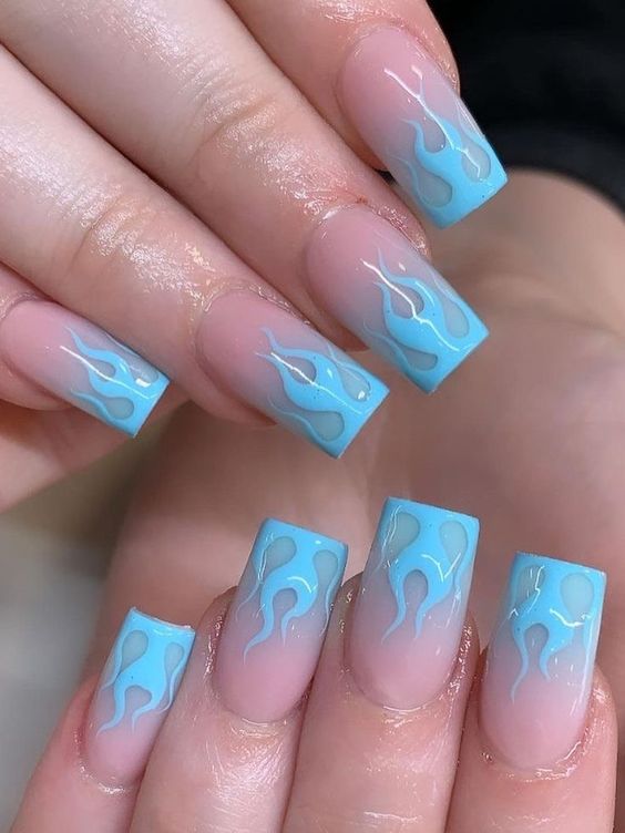 Square nails with blue flame design, bold and edgy