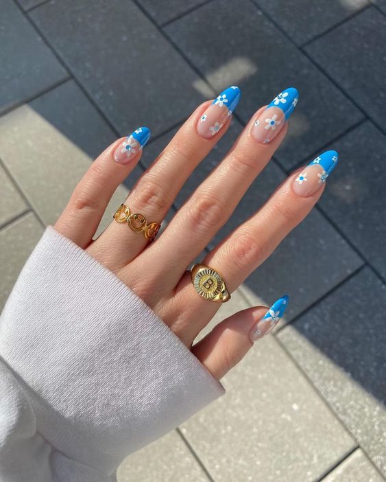 Blue floral design on long nails