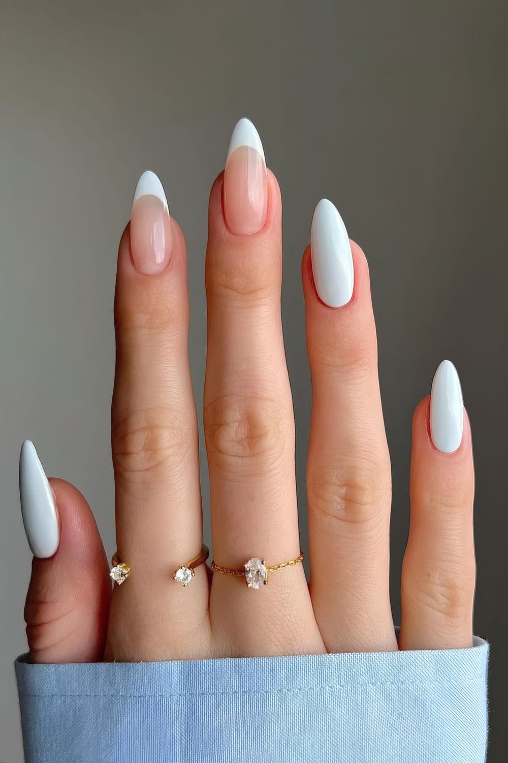 Soft white and blue contrast on oval nails