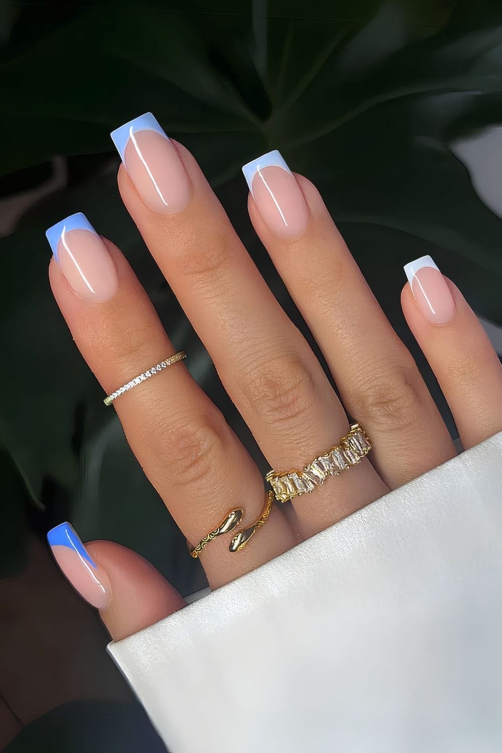 Modern French manicure with blue tips