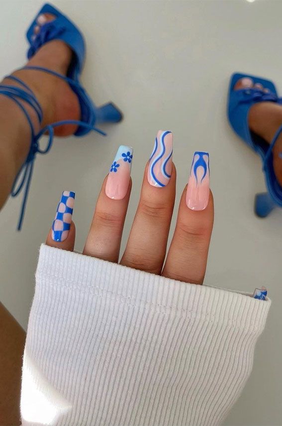 Eclectic blue nail art with various patterns