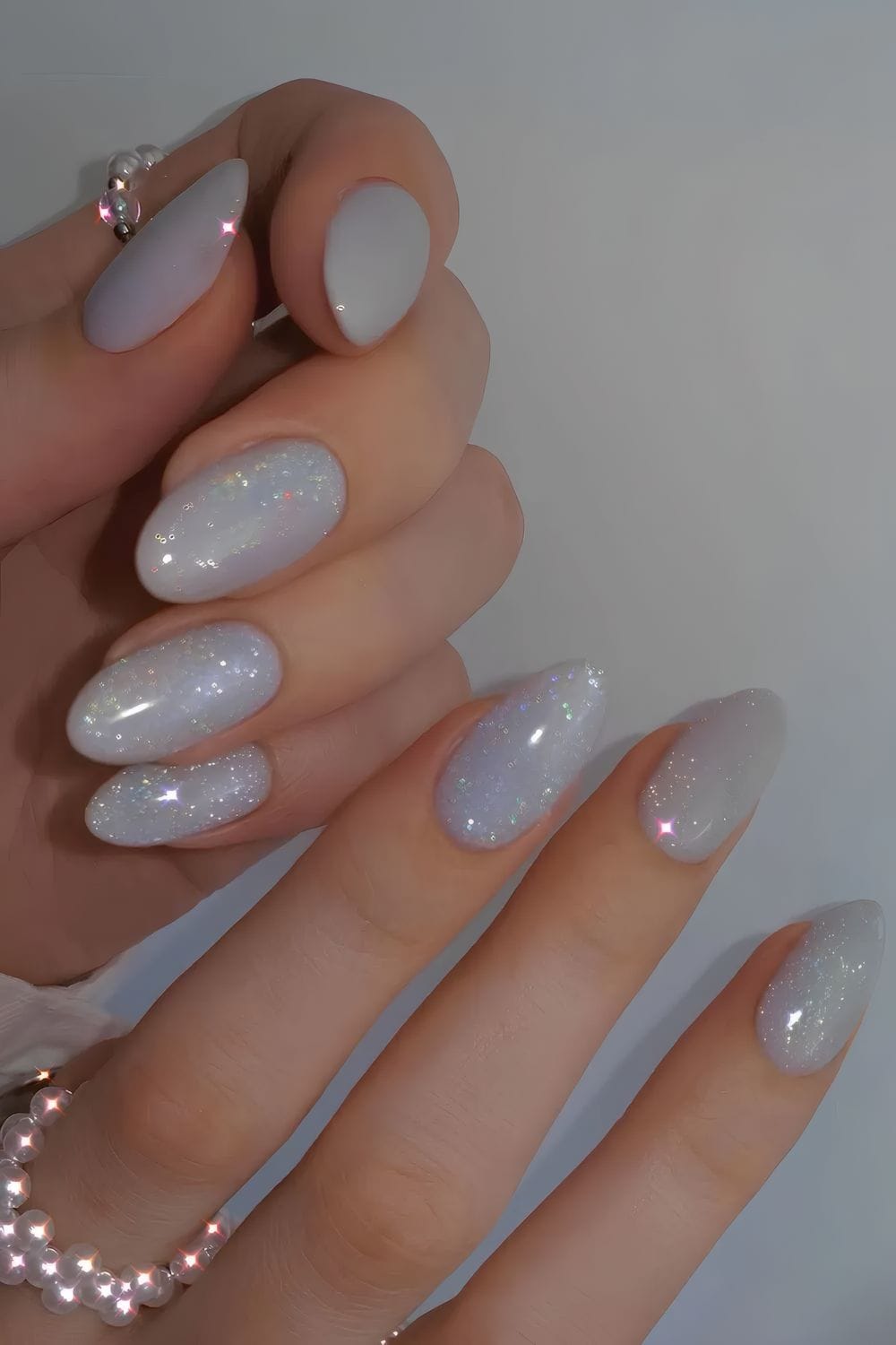 Glittery iridescent nails with almond shape
