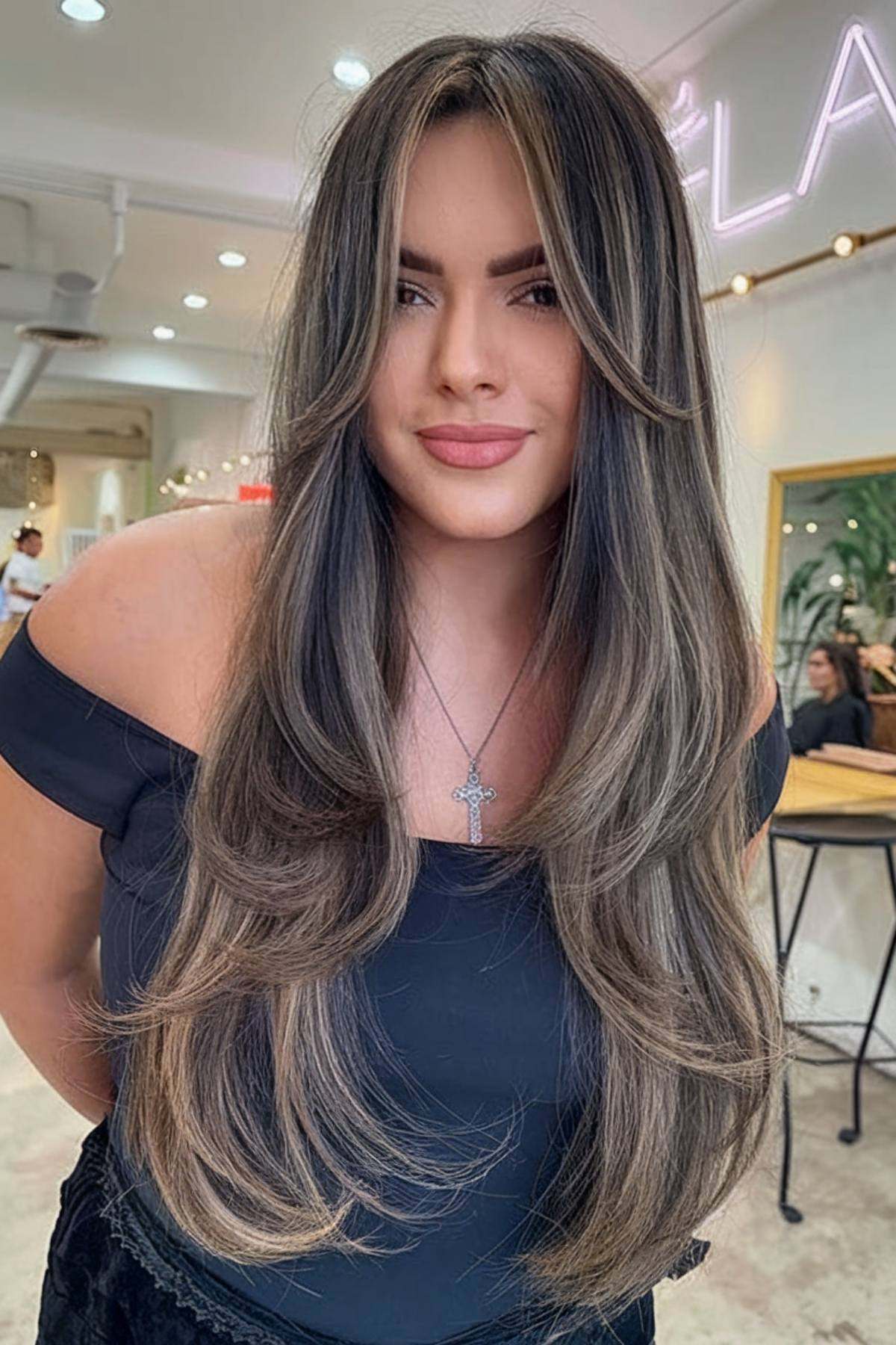 Layered highlights with face-framing bangs