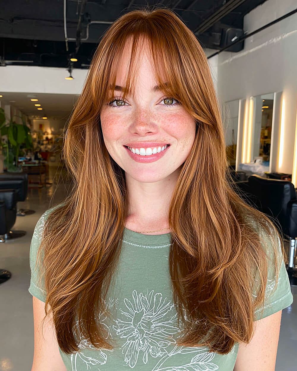 Golden auburn layers with airy bangs