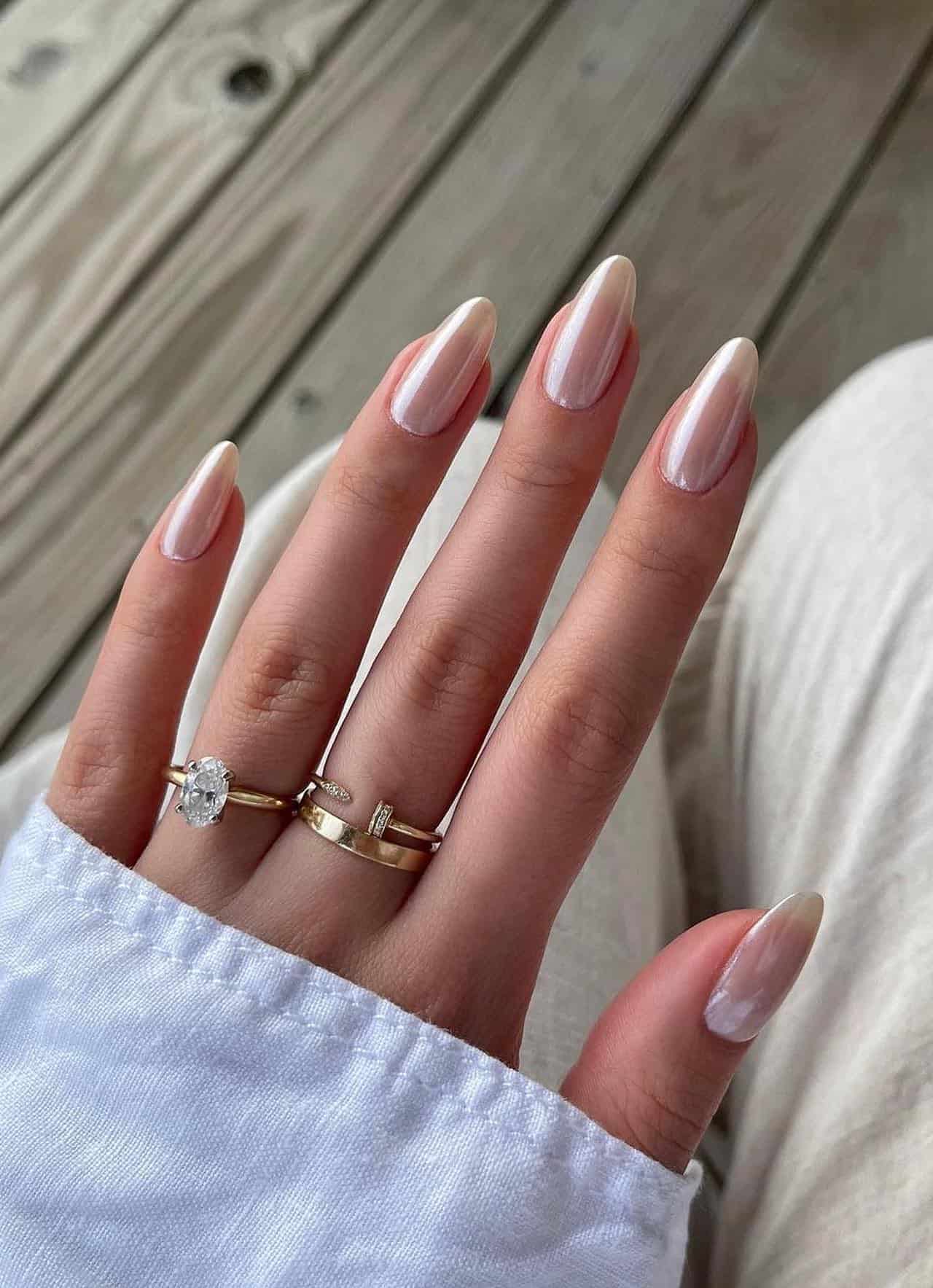 Pearly nude almond nails with elegant sheen