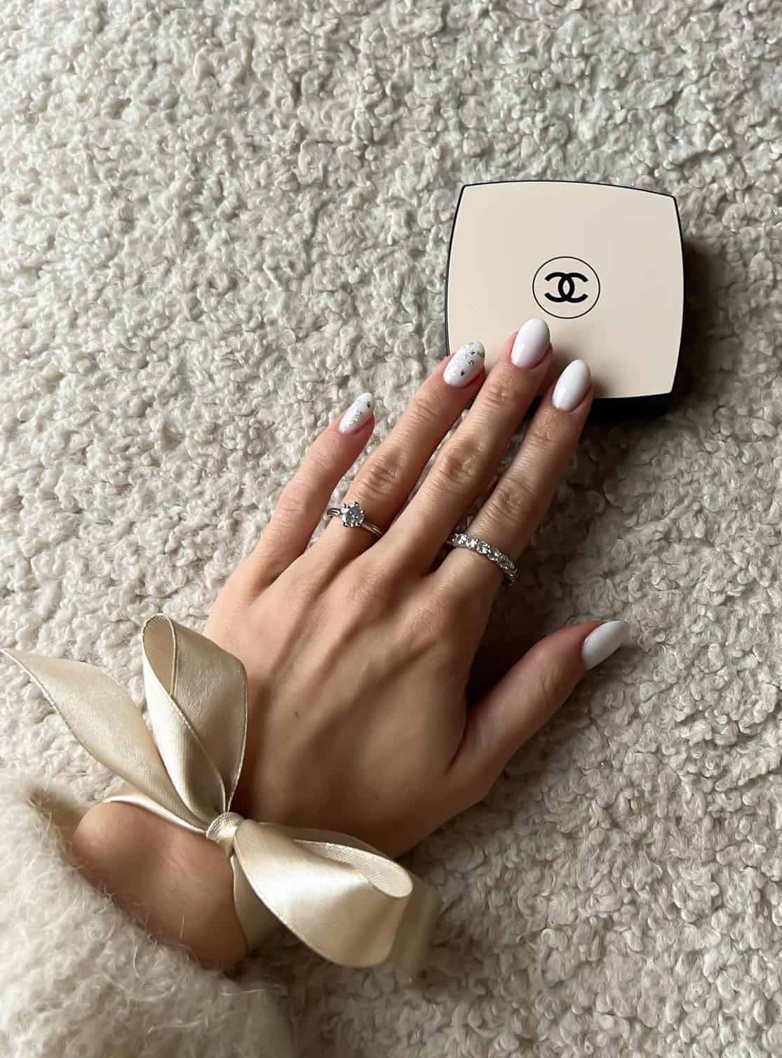 Minimalist white almond nails with subtle detail