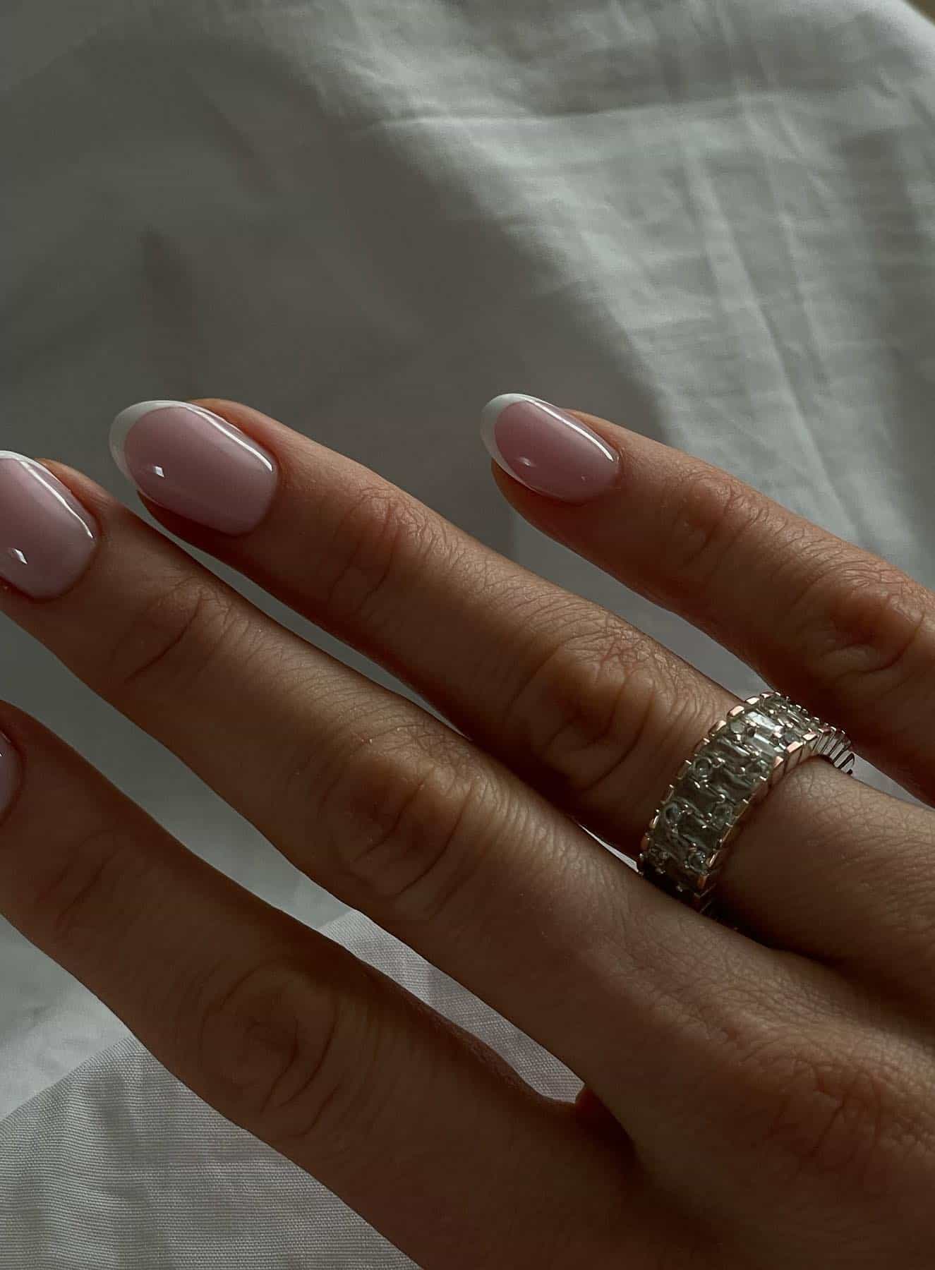 Classic French almond nails with white tips