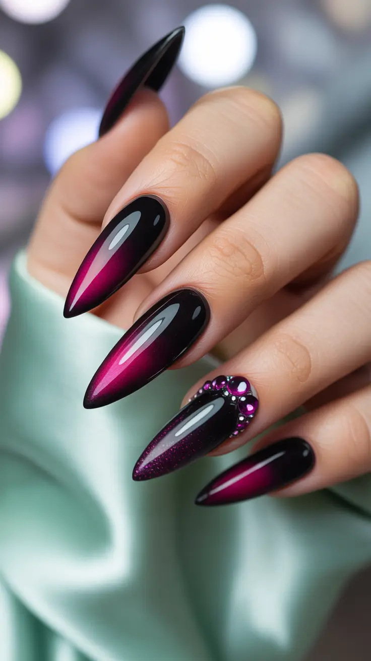 Black and magenta stiletto nails with rhinestones
