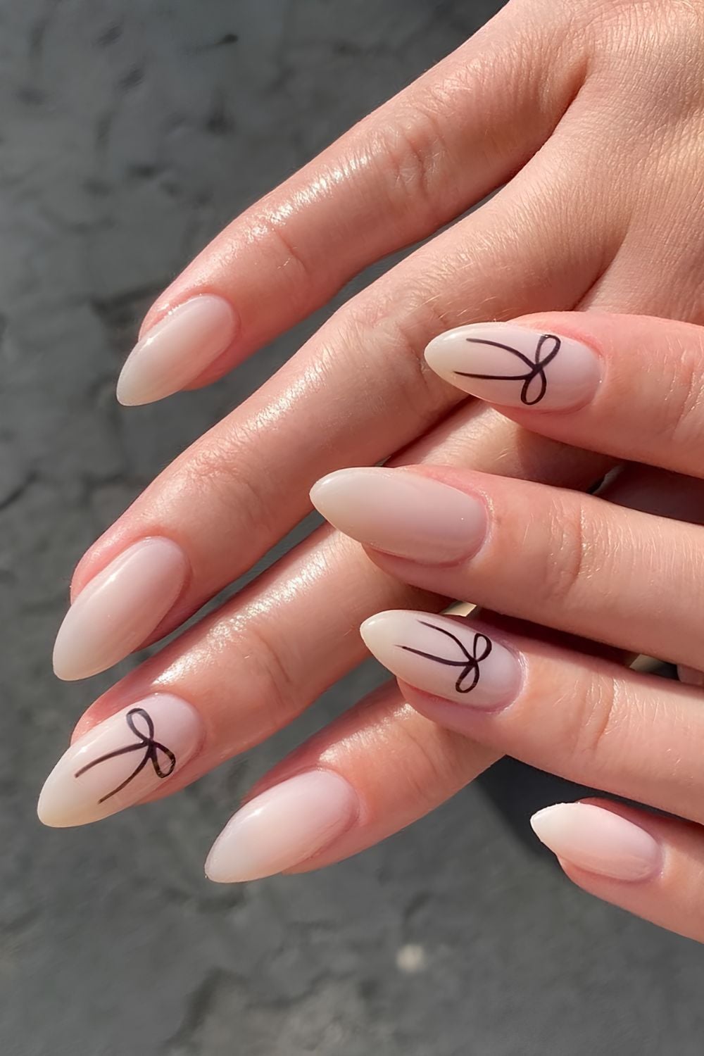 Milky nails with bow design, almond shape, minimalist elegance