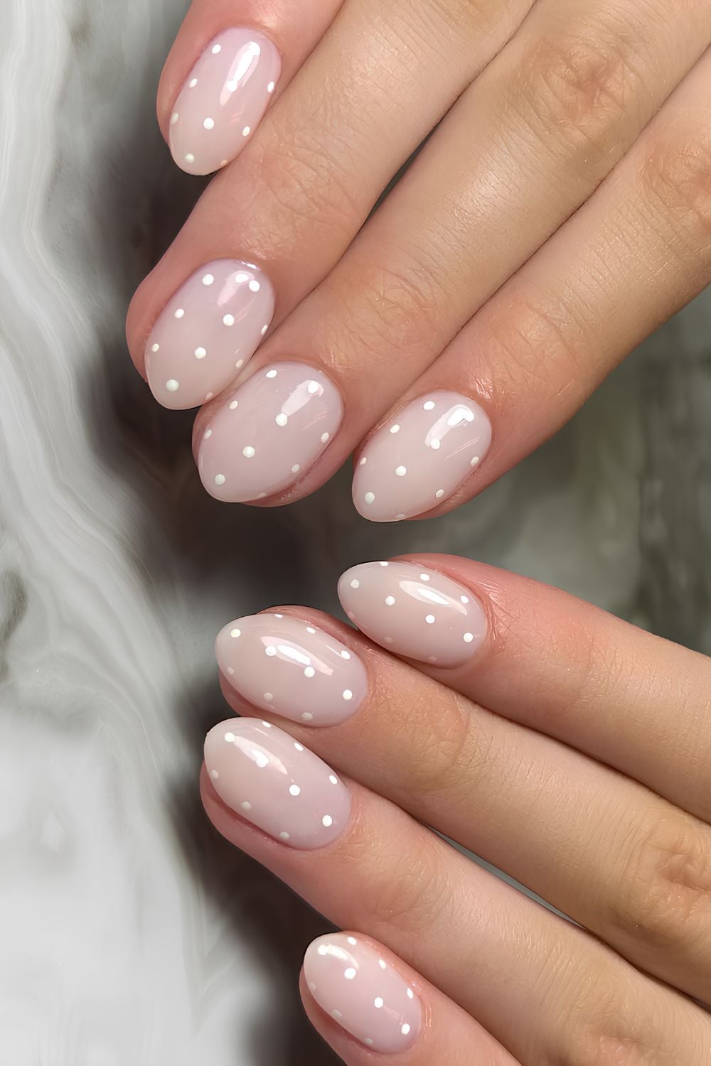 Milky nails with polka dots, almond shape, playful and trendy