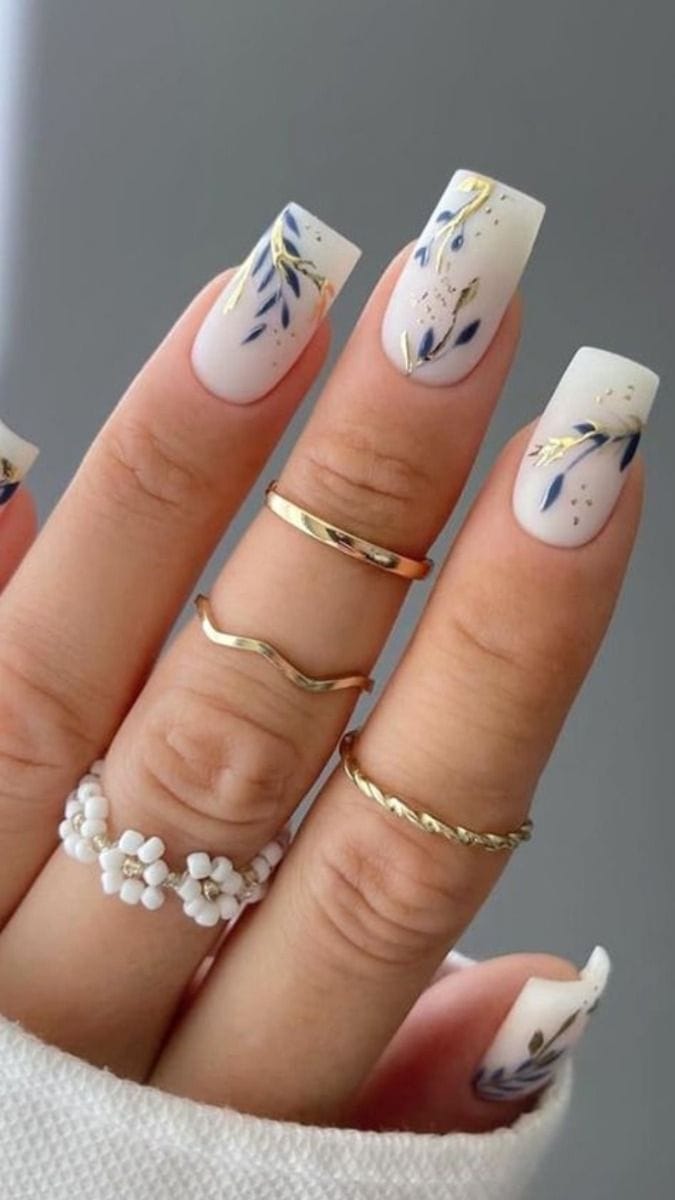 Artistic milky square nails, floral accents, chic and creative