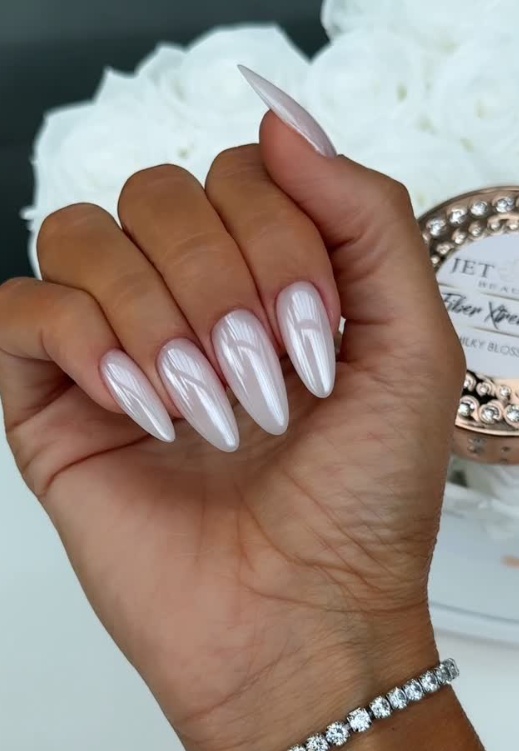 Milky stiletto nails, high gloss, sleek and sophisticated