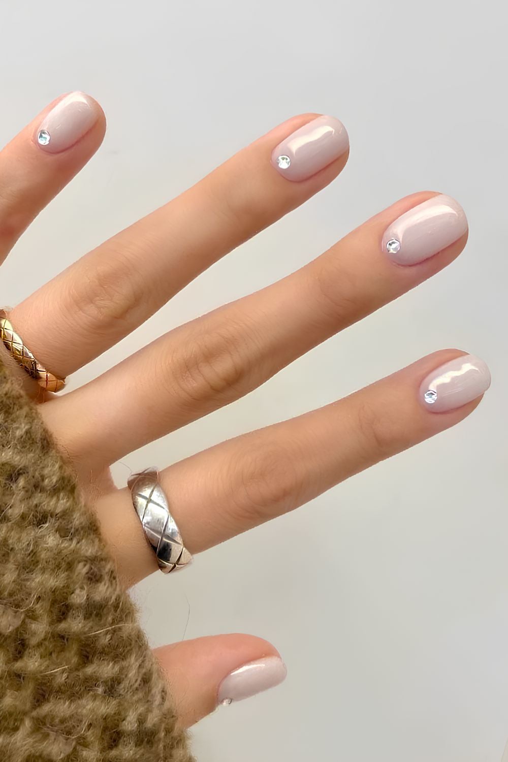 Minimalist nails with rhinestones, chic and subtle