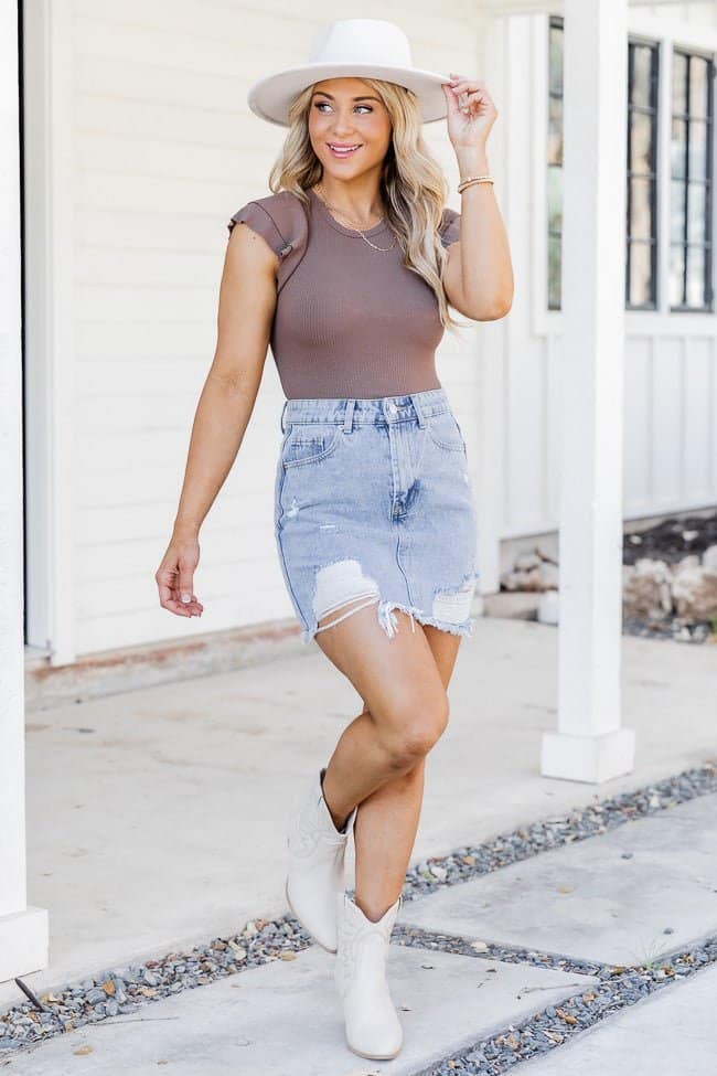 Denim mini skirt with boots and hat