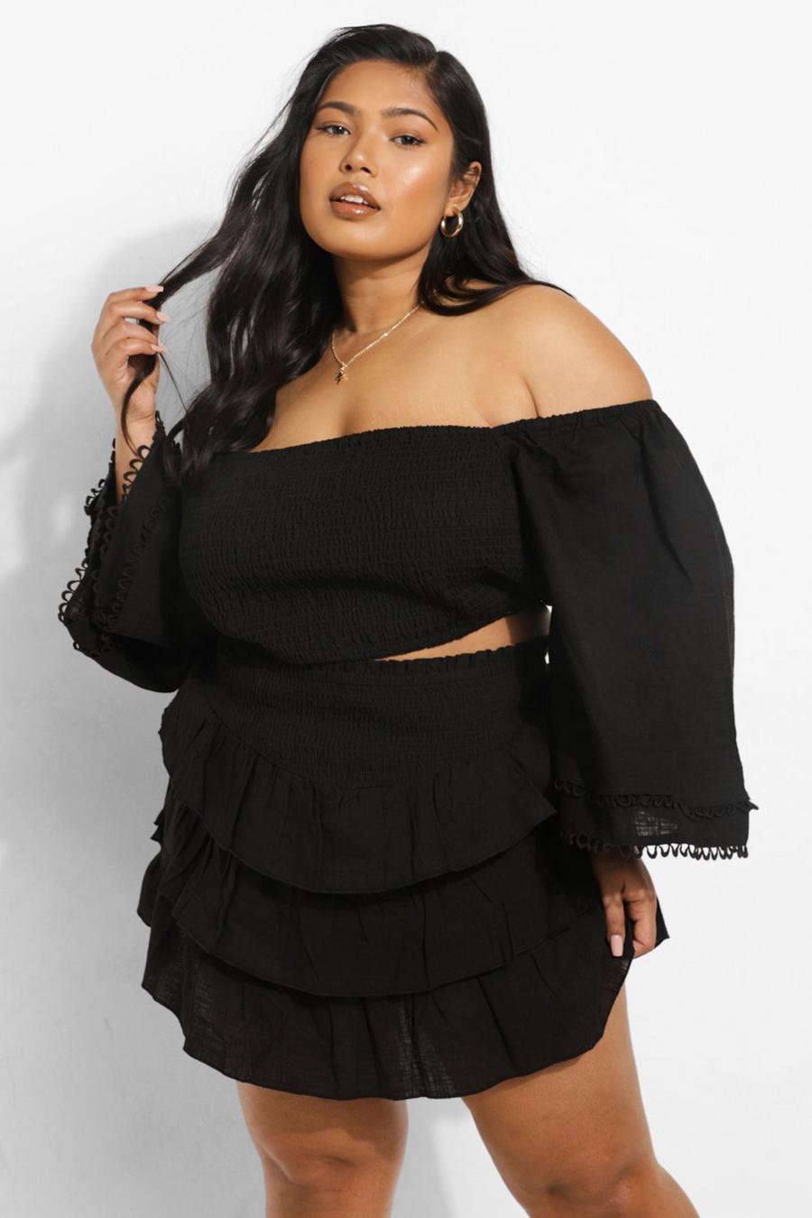 Black off-shoulder top and ruffled mini skirt