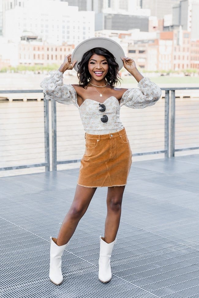 Off-shoulder top and corduroy mini skirt with boots