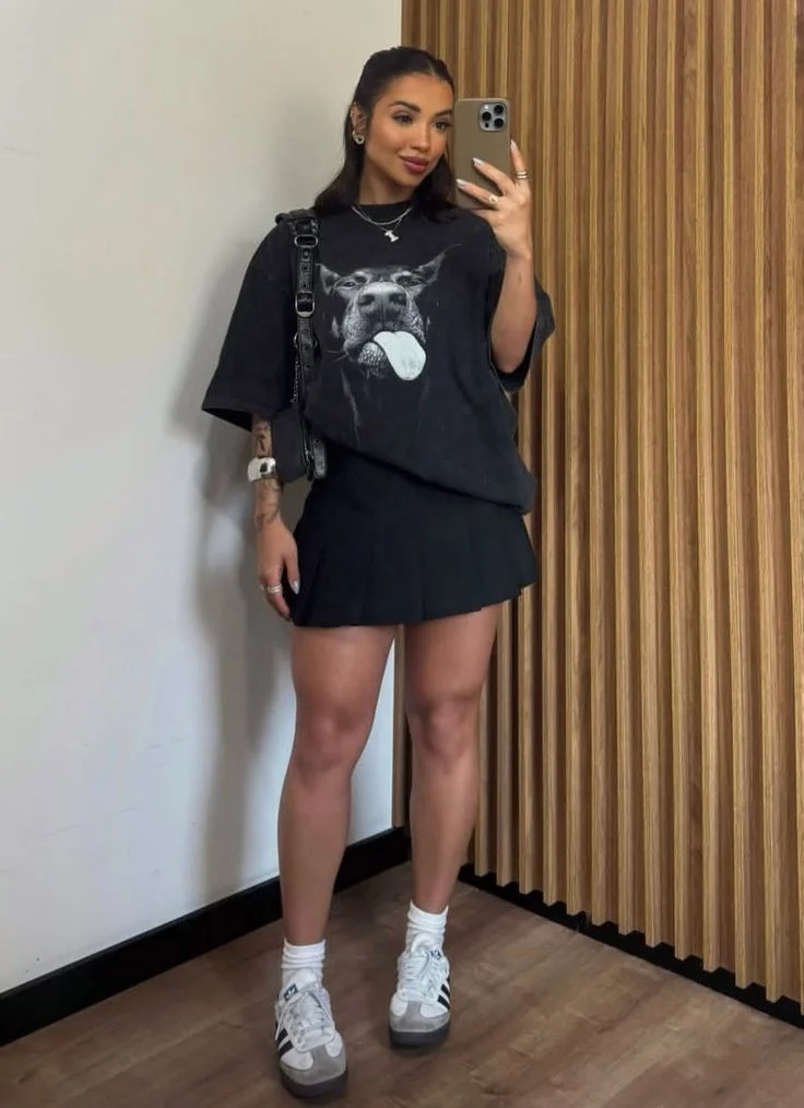 Graphic tee and pleated mini skirt
