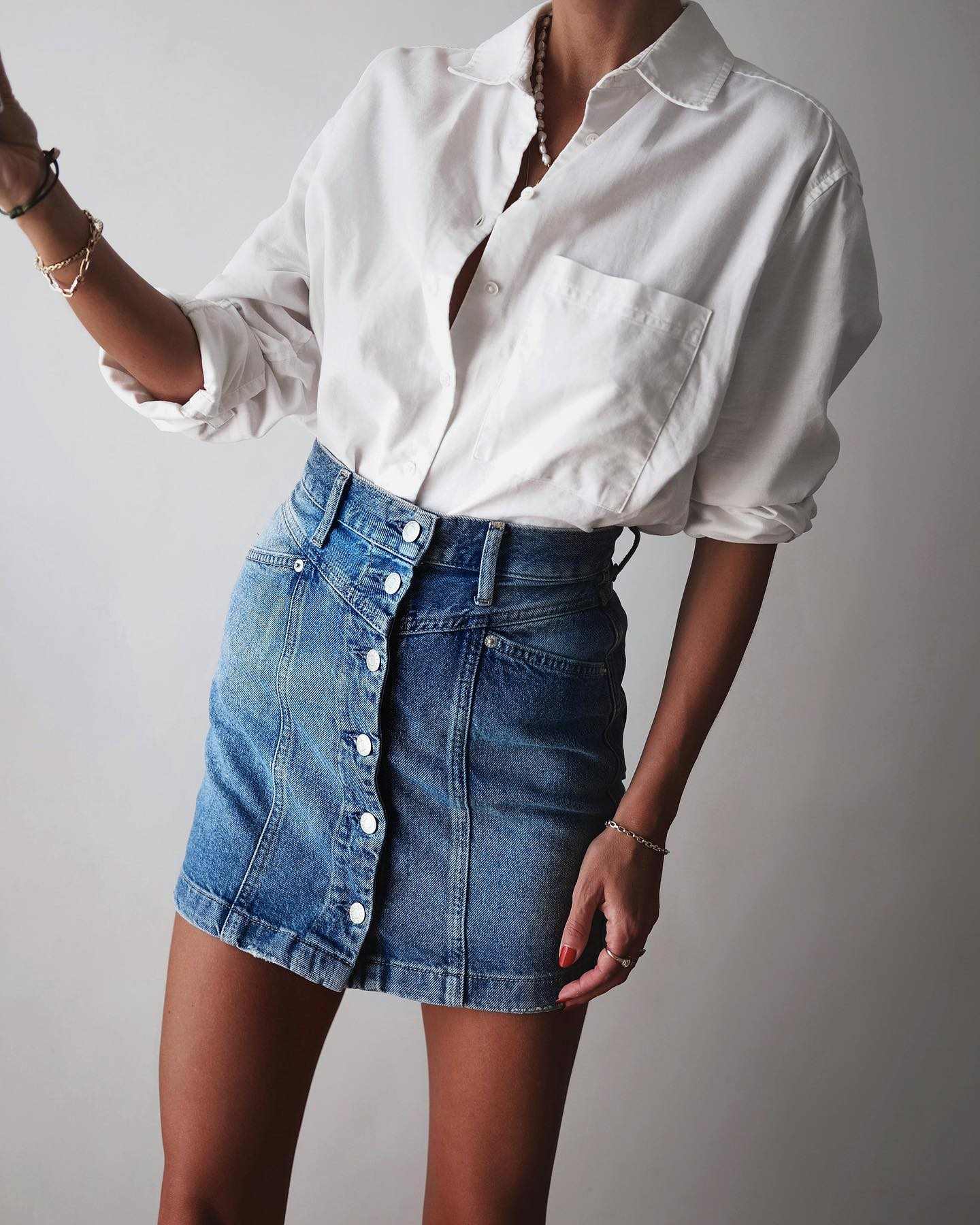 White shirt and buttoned denim mini skirt