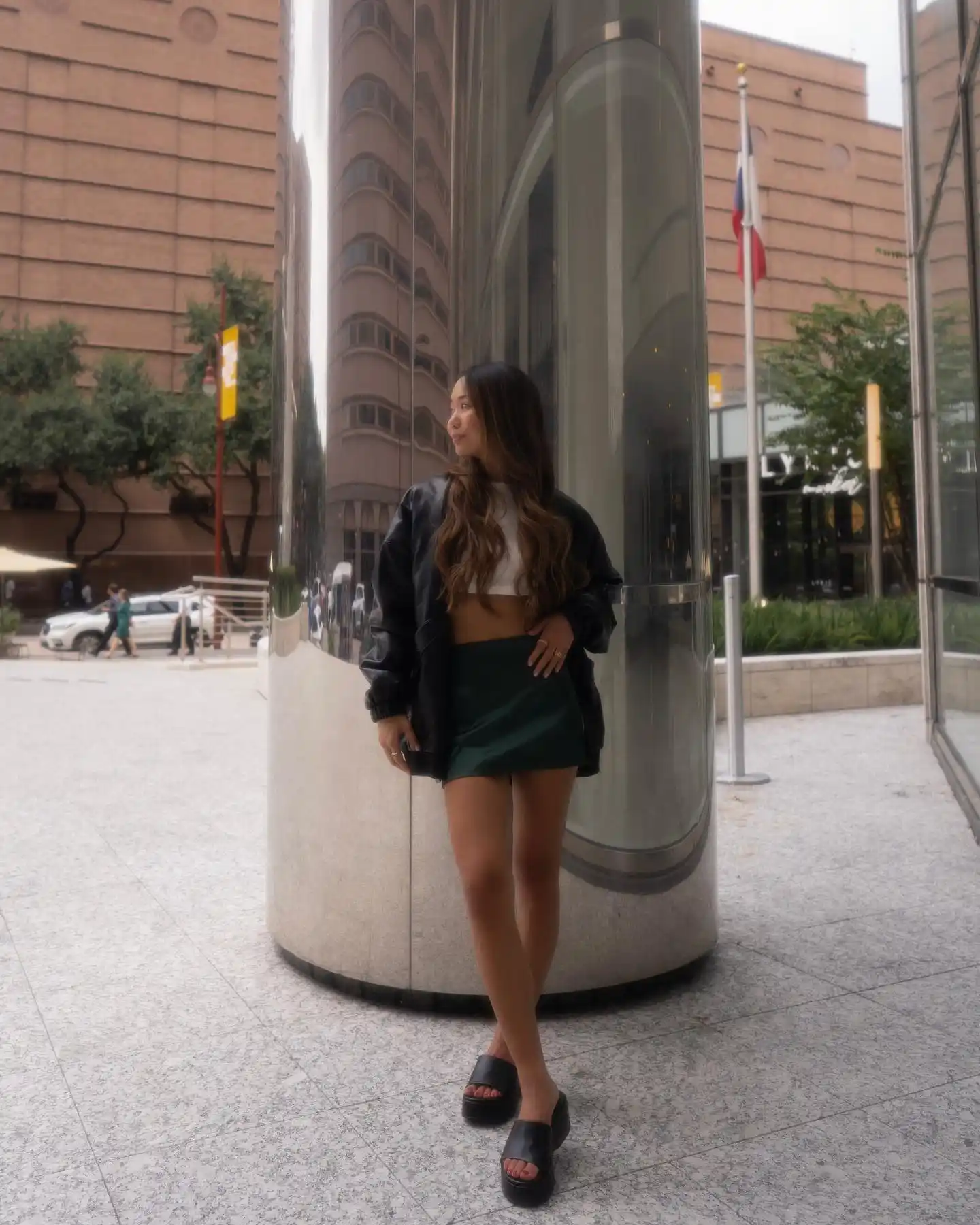 Leather jacket and green mini skirt