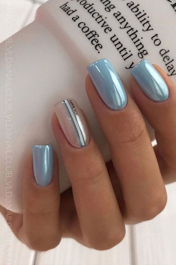 Sky blue nails with chrome accent stripe.