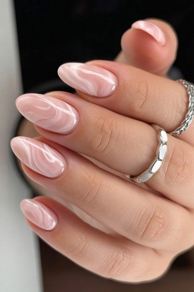 Almond nails with marble swirl design.