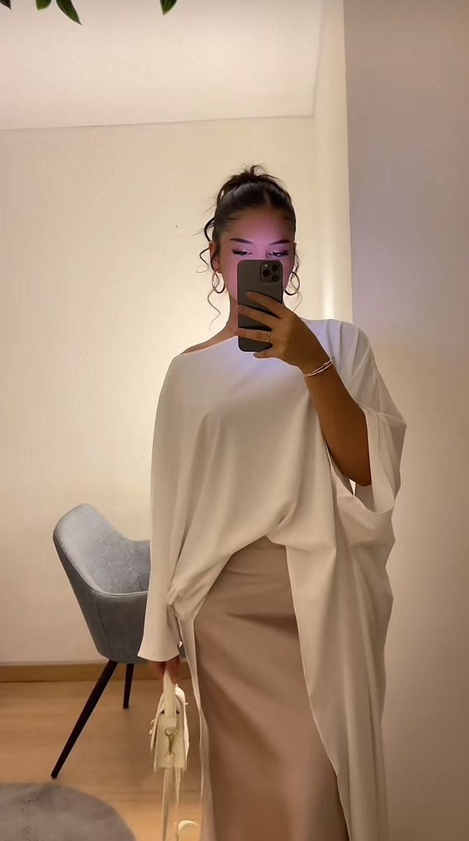 White draped top with beige skirt