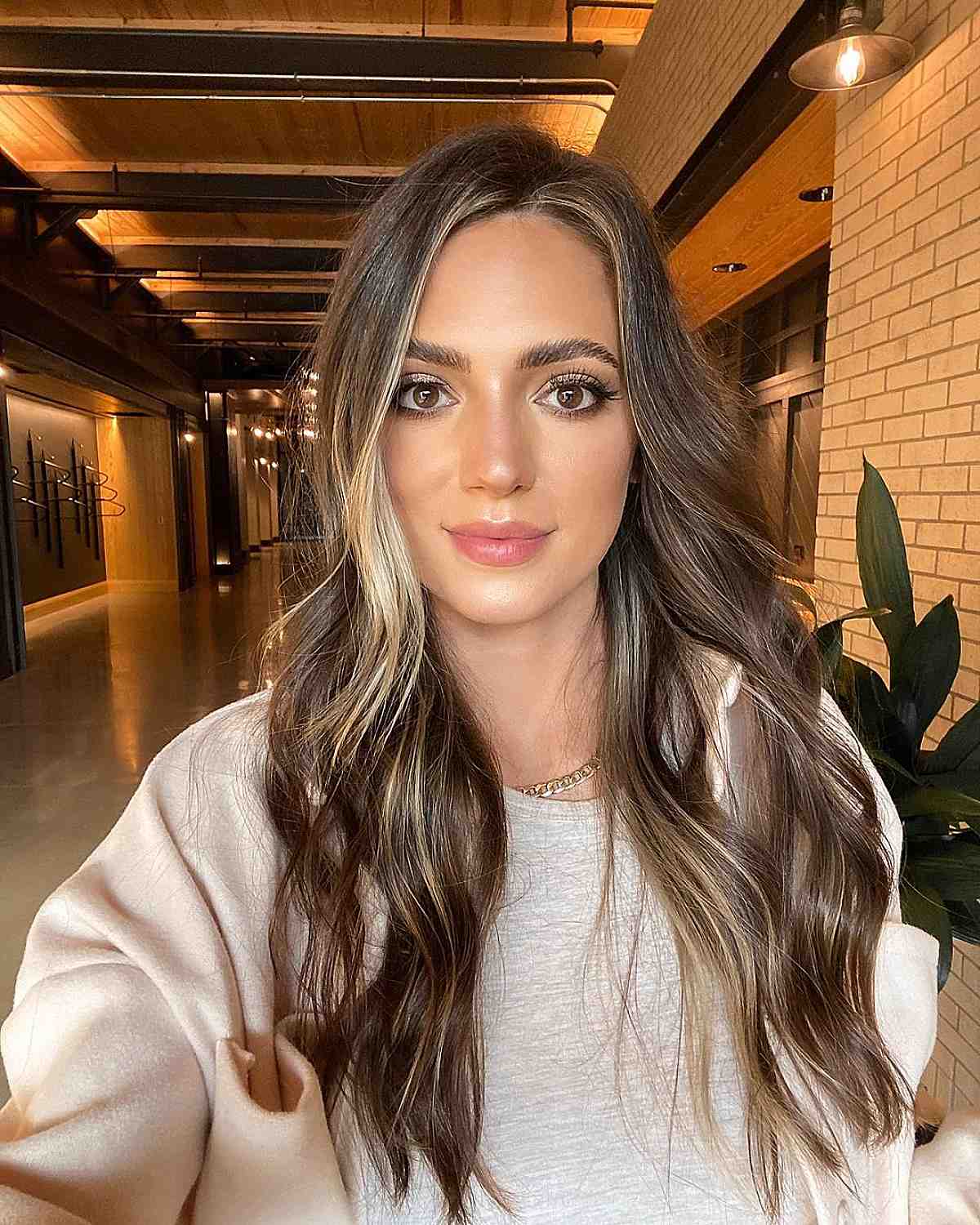 Modern brunette with dimensional money piece highlights