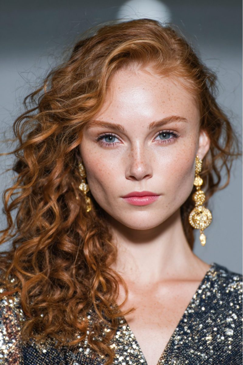 Curly red hair with subtle highlights