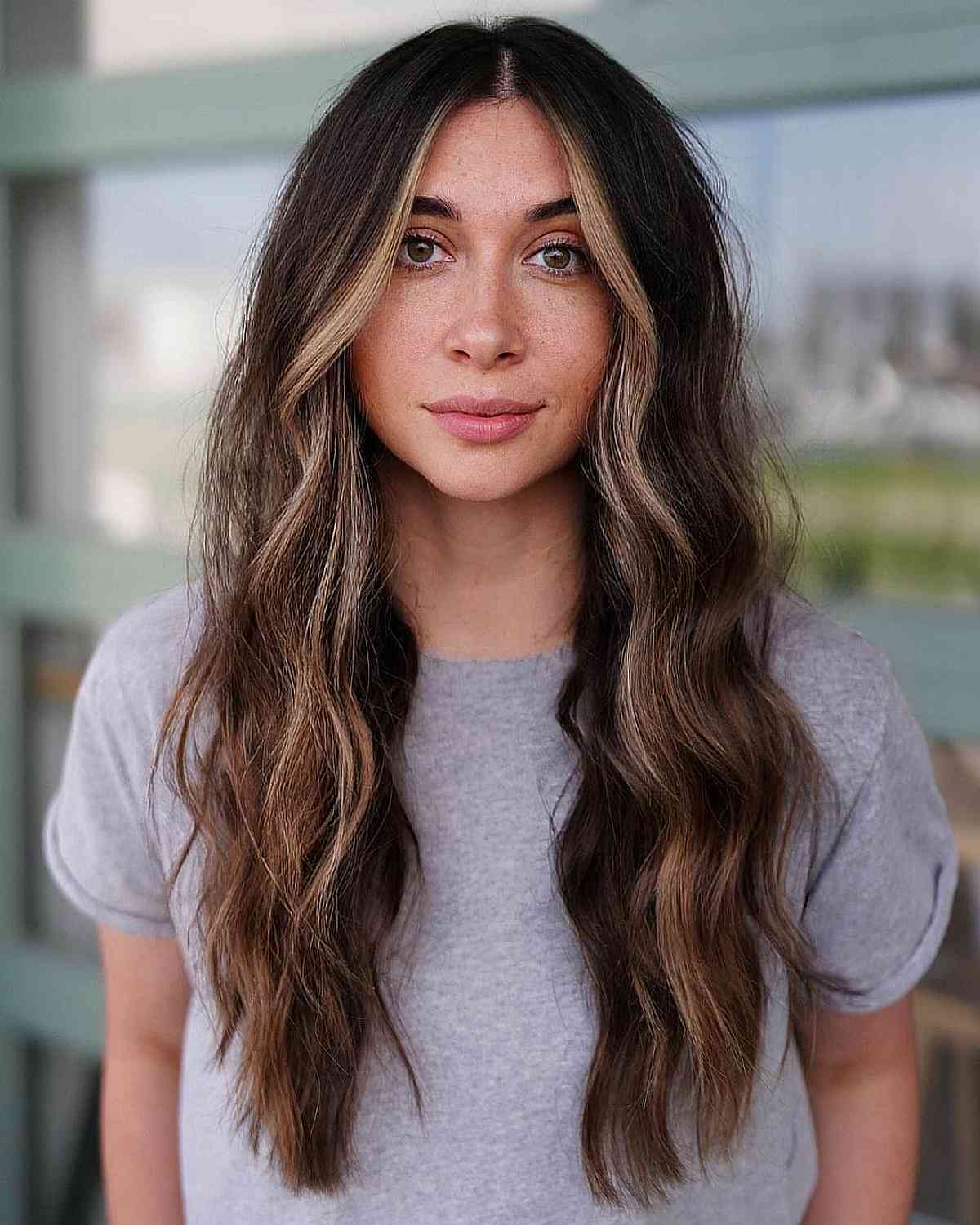Long waves with face-framing blonde streaks