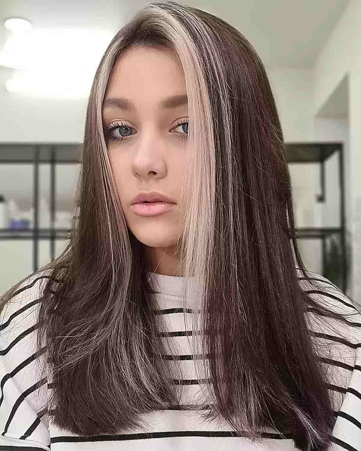 Sleek straight hair with platinum highlight